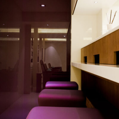 An eco-friendly beauty salon incorporates sustainable materials and organic products.