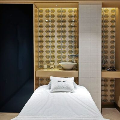 The salon's relaxing ambiance is enhanced by soothing music and aromatherapy scents.