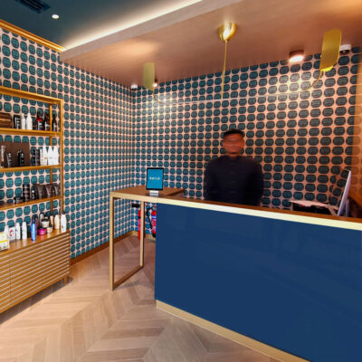 The salon's sleek design includes chic mirrors and stylish hair stations.