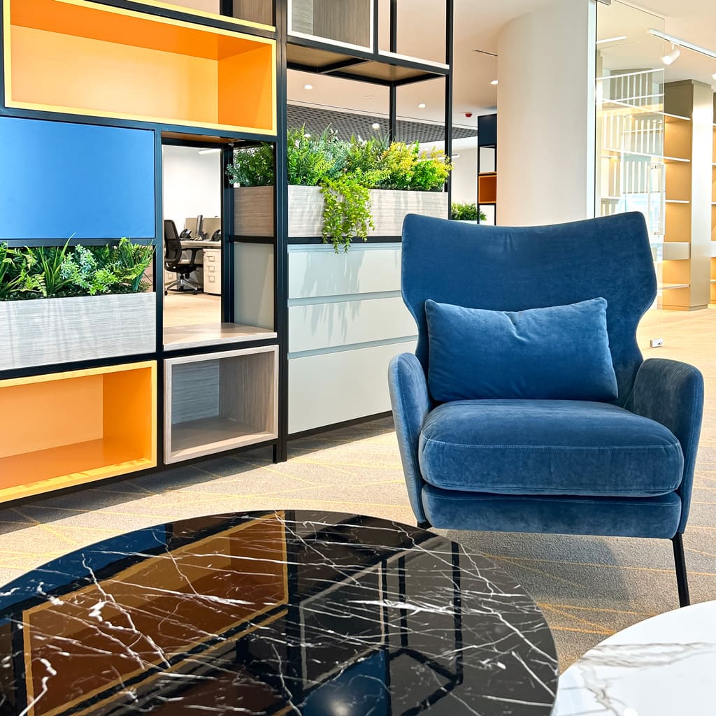 A reception waiting area with accent chairs