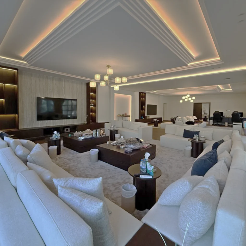 Modern Men's majlis interior design with a continue sofa setting