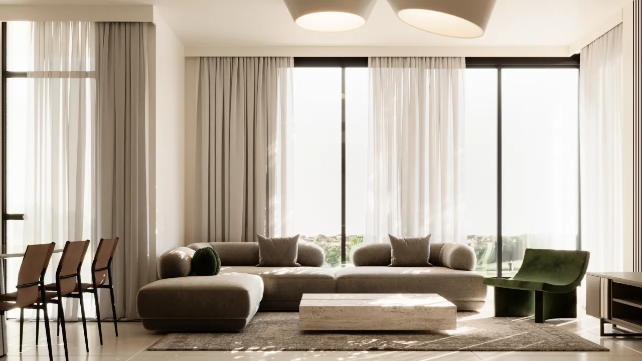 Warm neutral apartment living room design with rounded beige sectional sofa, large windows, sheer curtains